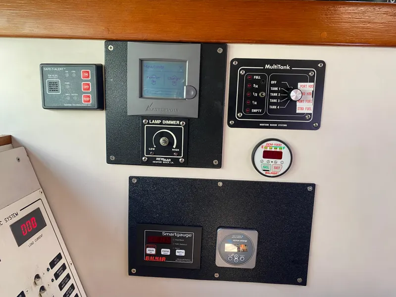 Slide: The Image of Control panel with various gauges and displays on a 1995 Sundeer 56 yacht. - 24