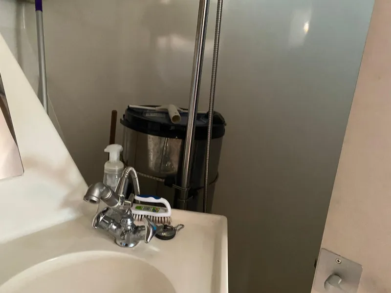 Slide: The Image of Bathroom sink area with cleaning supplies, Sundeer 56, 1995 model. - 25