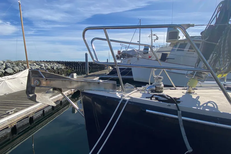 Slide: The Image of Sundeer 56 sailboat from 1995 docked, featuring anchor and deck equipment. - 44