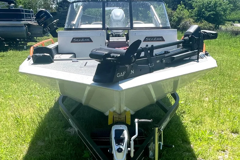 Slide: The Image of 2022 SeaArk ProCat 240 boat on trailer, parked on grass, front view. - 1