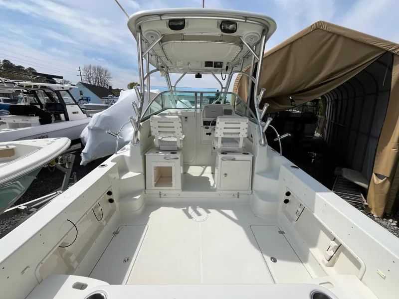 Slide: The Image of 2008 Sailfish 2360 WAC boat interior with dual seats and open deck. - 3
