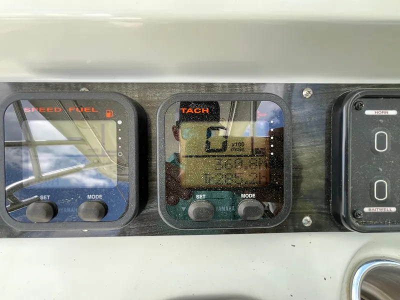 Slide: The Image of Dashboard of a 2008 Sailfish 2360 WAC boat showing speed, fuel, and tachometer gauges. - 5
