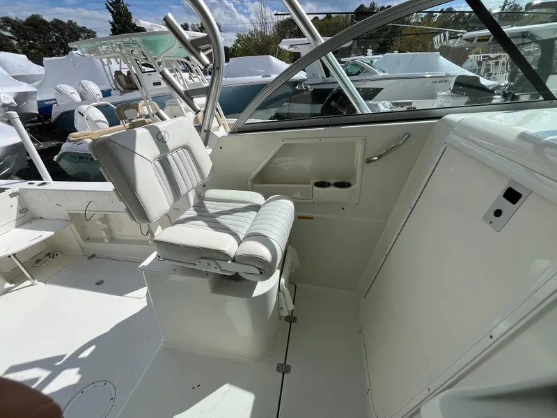 Slide: The Image of 2008 Sailfish 2360 WAC boat interior with helm seat and dashboard. - 9
