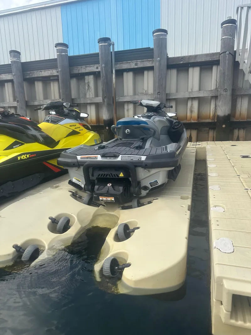 Slide: The Image of 2021 Sea-Doo GTX Limited 300 jet ski docked at marina. - 10
