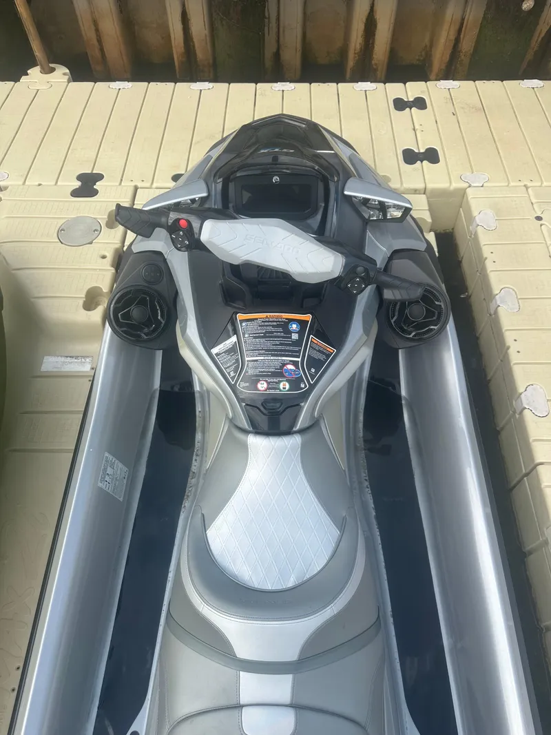Slide: The Image of 2021 Sea-Doo GTX Limited 300 jet ski on dock, top view. - 8