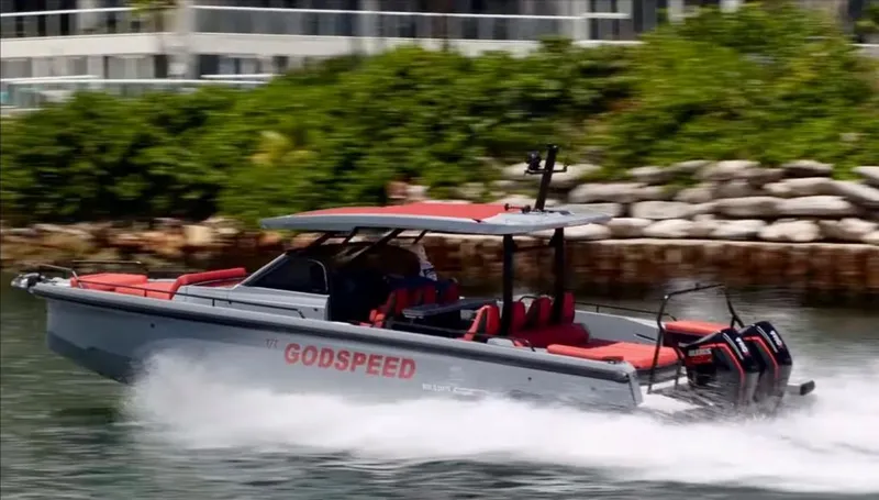 Slide: The Image of 2022 Axopar Brabus Shadow 900 ST speeding on water, featuring sleek design and powerful engines. - 1