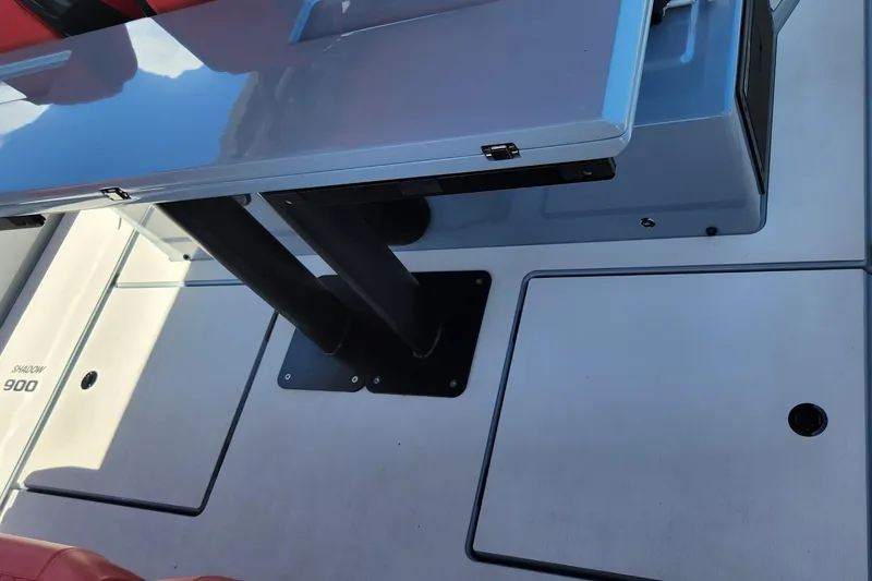 Slide: The Image of 2022 Axopar Brabus Shadow 900 ST deck with sleek table and seating. - 11