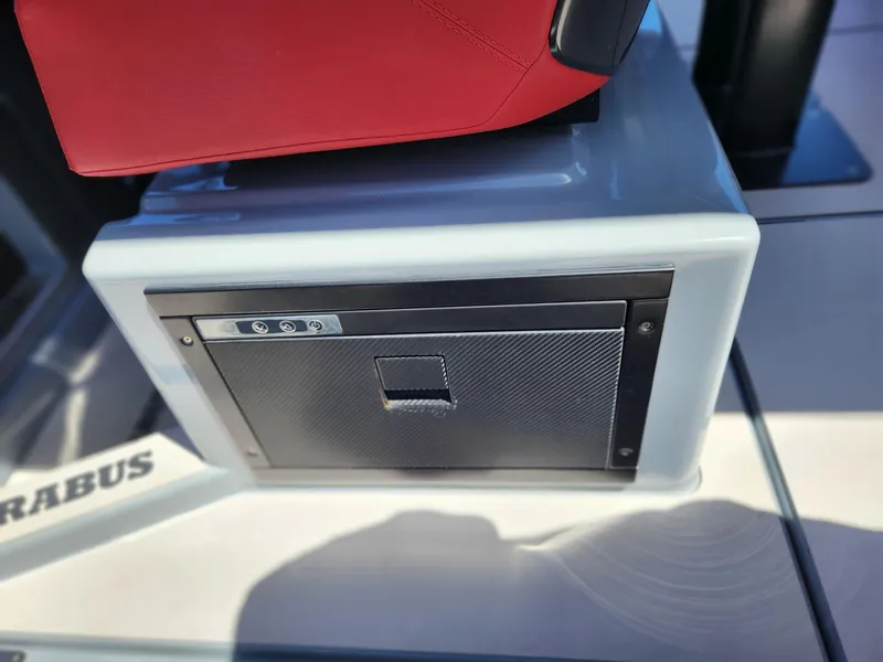 Slide: The Image of 2022 Axopar Brabus Shadow 900 ST interior detail with red seat and storage compartment. - 13