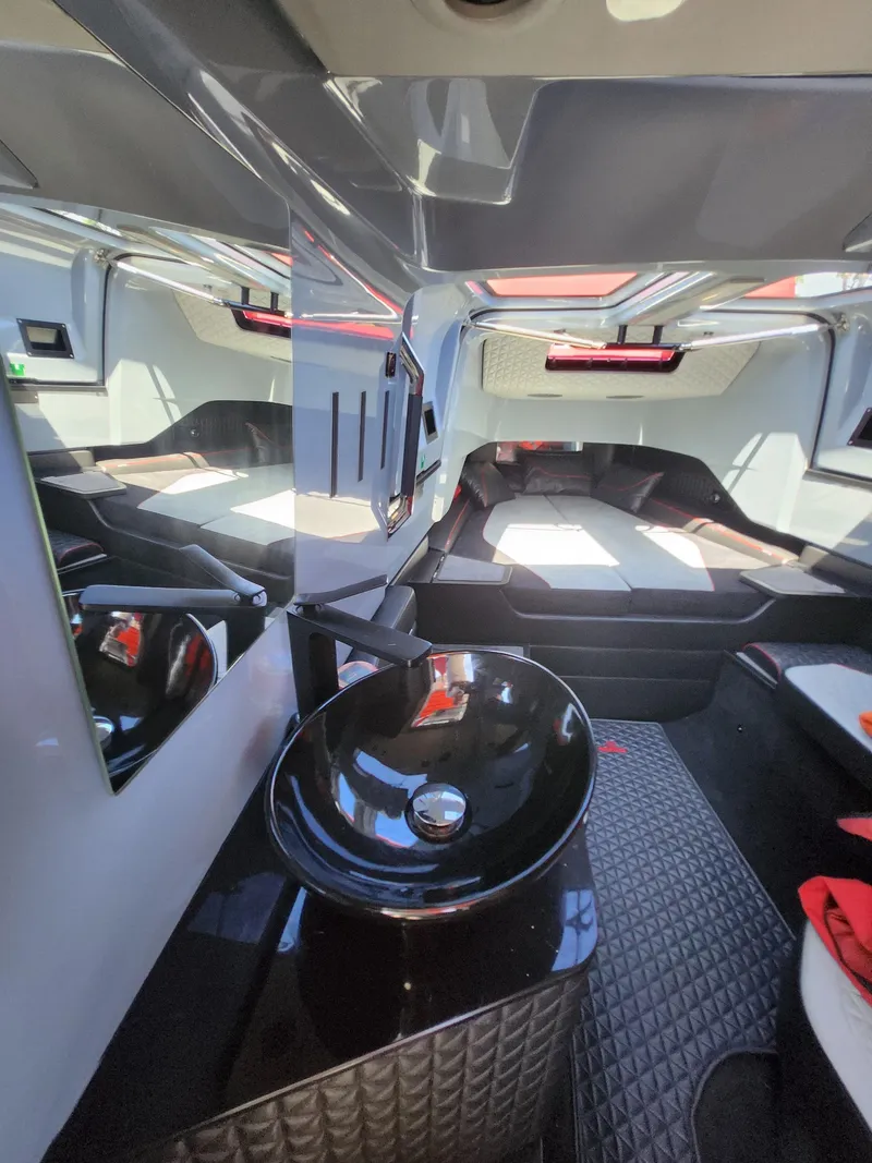 Slide: The Image of Interior of 2022 Axopar Brabus Shadow 900 ST, featuring modern design and sleek black sink. - 15