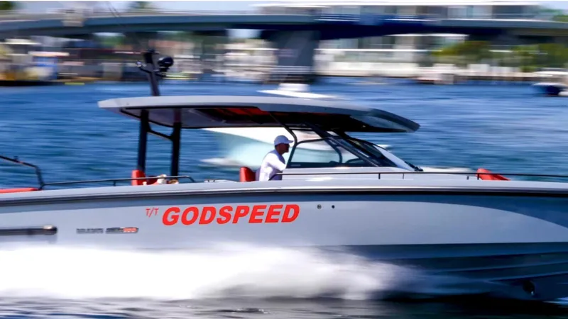 Slide: The Image of 2022 Axopar Brabus Shadow 900 ST speeding on water, labeled "GODSPEED." - 22