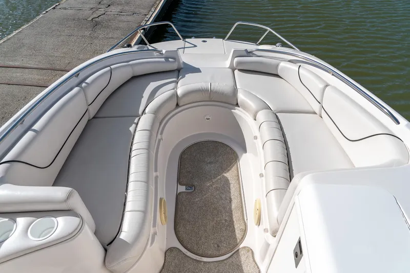 Slide: The Image of 2002 Ebbtide 2400 Mystique Fun Cruiser boat interior with spacious seating and elegant design. - 11