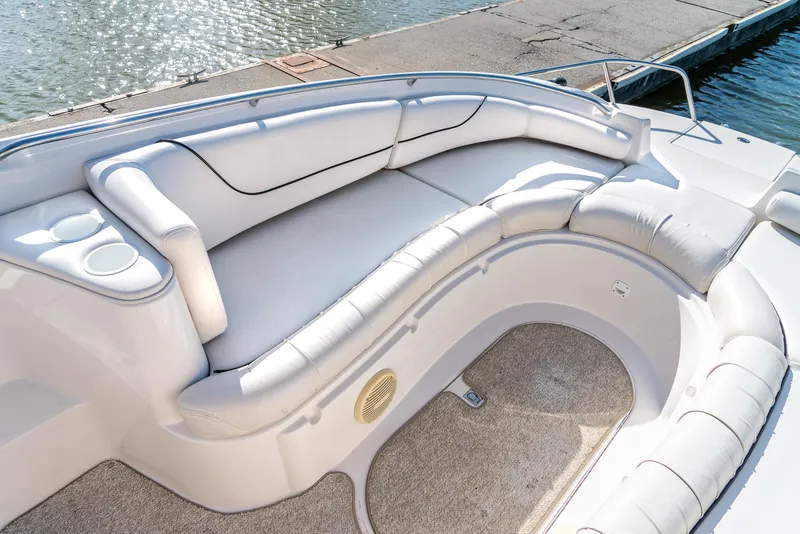 Slide: The Image of Luxurious seating on 2002 Ebbtide 2400 Mystique Fun Cruiser boat by the dock. - 12