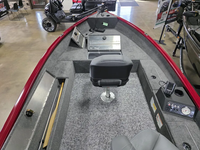 Slide: The Image of 2025 Tracker Super Guide V 16 T boat interior with seating and control panel. - 13