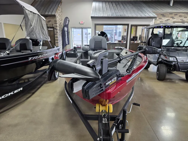 Slide: The Image of 2025 Tracker Super Guide V 16 T boat displayed indoors, featuring a Minn Kota trolling motor. - 3