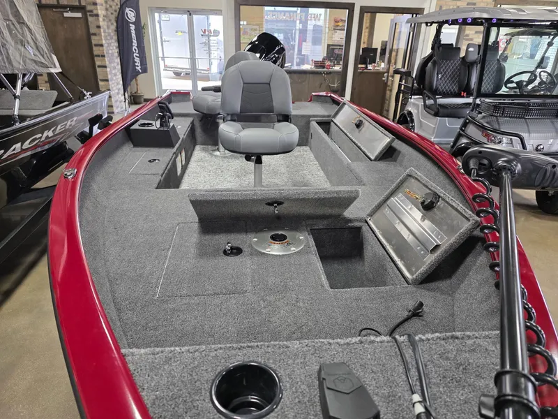 Slide: The Image of 2025 Tracker Super Guide V 16 T boat interior with seating and control panel. - 4