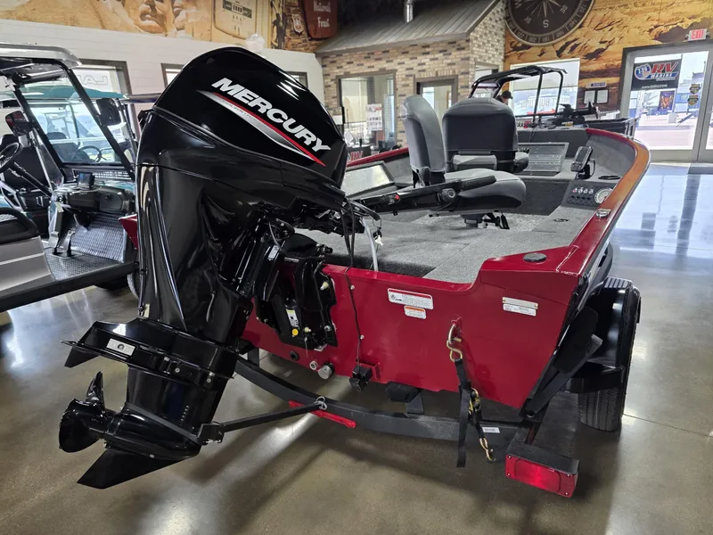 Slide: The Image of 2025 Tracker Super Guide V 16 T boat with Mercury outboard motor in showroom. - 5