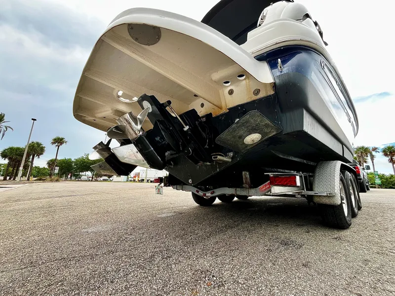 Slide: The Image of 2005 Sea Ray 280 Sundancer boat on trailer, rear view, showing propellers and hull. - 16
