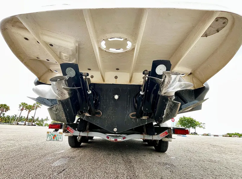 Slide: The Image of 2005 Sea Ray 280 Sundancer boat on trailer, showing dual propellers and stern drive. - 18