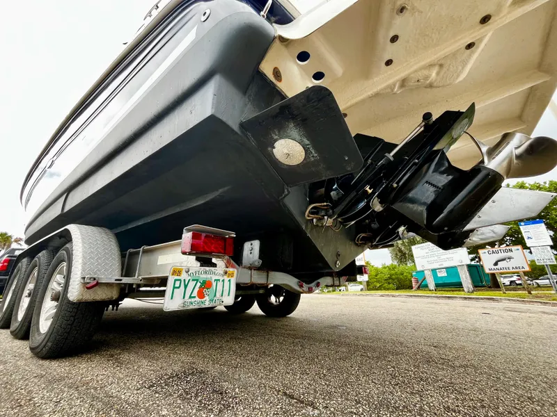 Slide: The Image of 2005 Sea Ray 280 Sundancer on trailer, rear view, showing outdrive and license plate. - 20