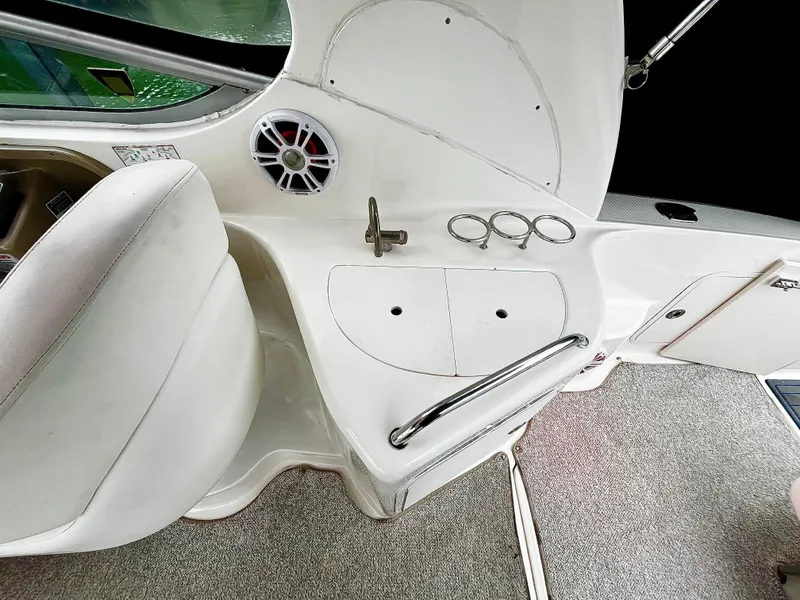 Slide: The Image of 2005 Sea Ray 280 Sundancer interior with seating, speaker, and cup holders. - 41