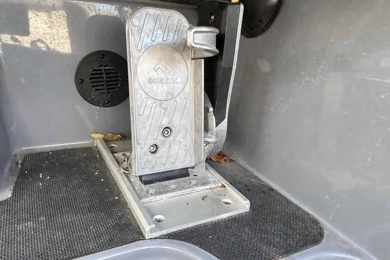 Slide: The Image of Foot pedal in a 2024 Triton 19 TrX boat interior. - 12