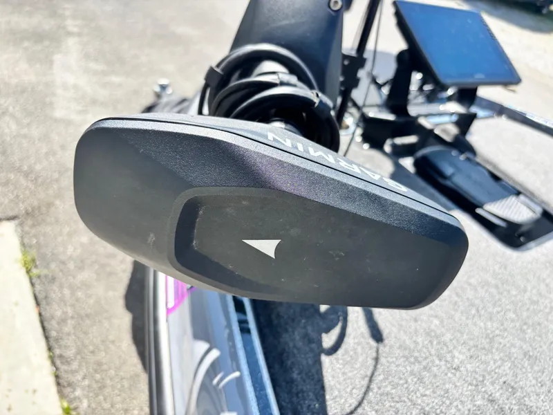 Slide: The Image of Close-up of a 2024 Triton 19 TrX boat's navigation system on a sunny day. - 3