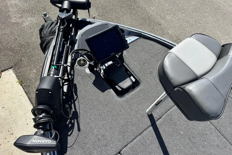 Slide: The Image of 2024 Triton 19 TrX boat deck with Garmin equipment and seating. - 5