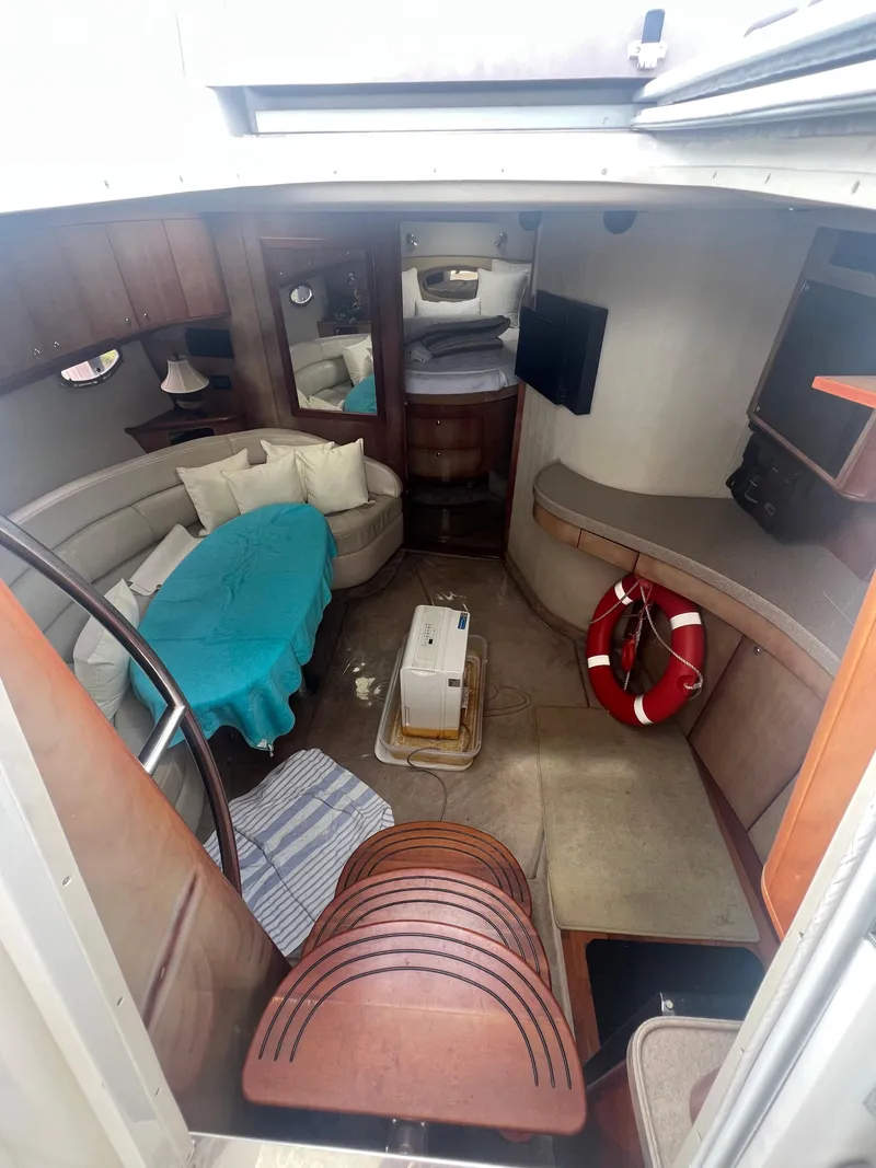 Slide: The Image of 2003 Regal Commodore 4260 yacht interior with seating, table, and life preserver. - 13