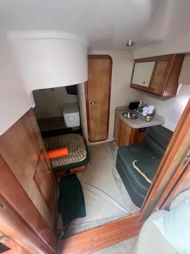 Slide: The Image of Interior of 2003 Regal Commodore 4260 yacht with kitchenette and seating area. - 15
