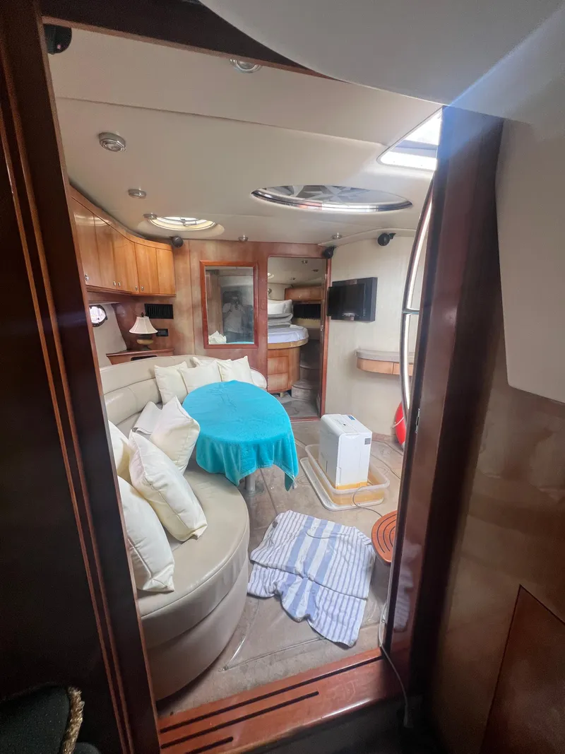 Slide: The Image of Interior of 2003 Regal Commodore 4260 yacht with cozy seating and modern amenities. - 25