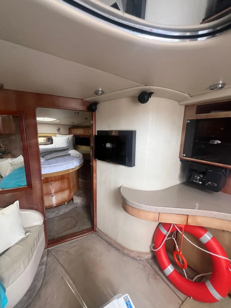Slide: The Image of Interior of 2003 Regal Commodore 4260 yacht with cozy seating and modern amenities. - 30