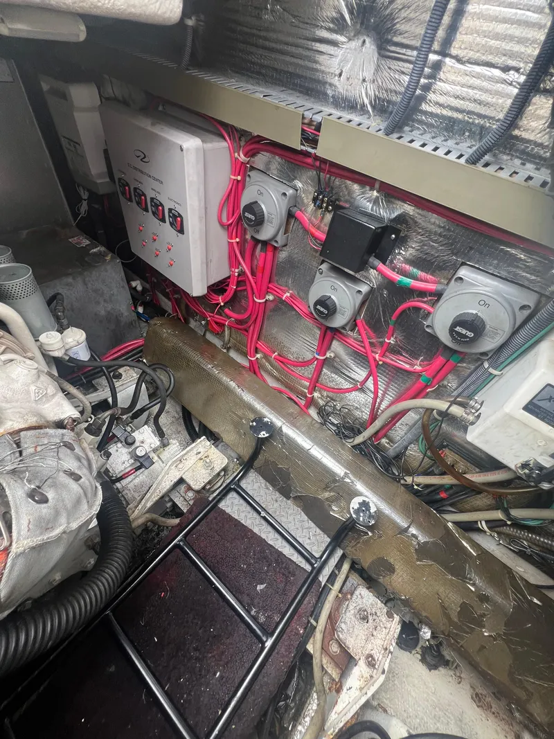 Slide: The Image of Engine room of 2003 Regal Commodore 4260 with wiring and control panel. - 48