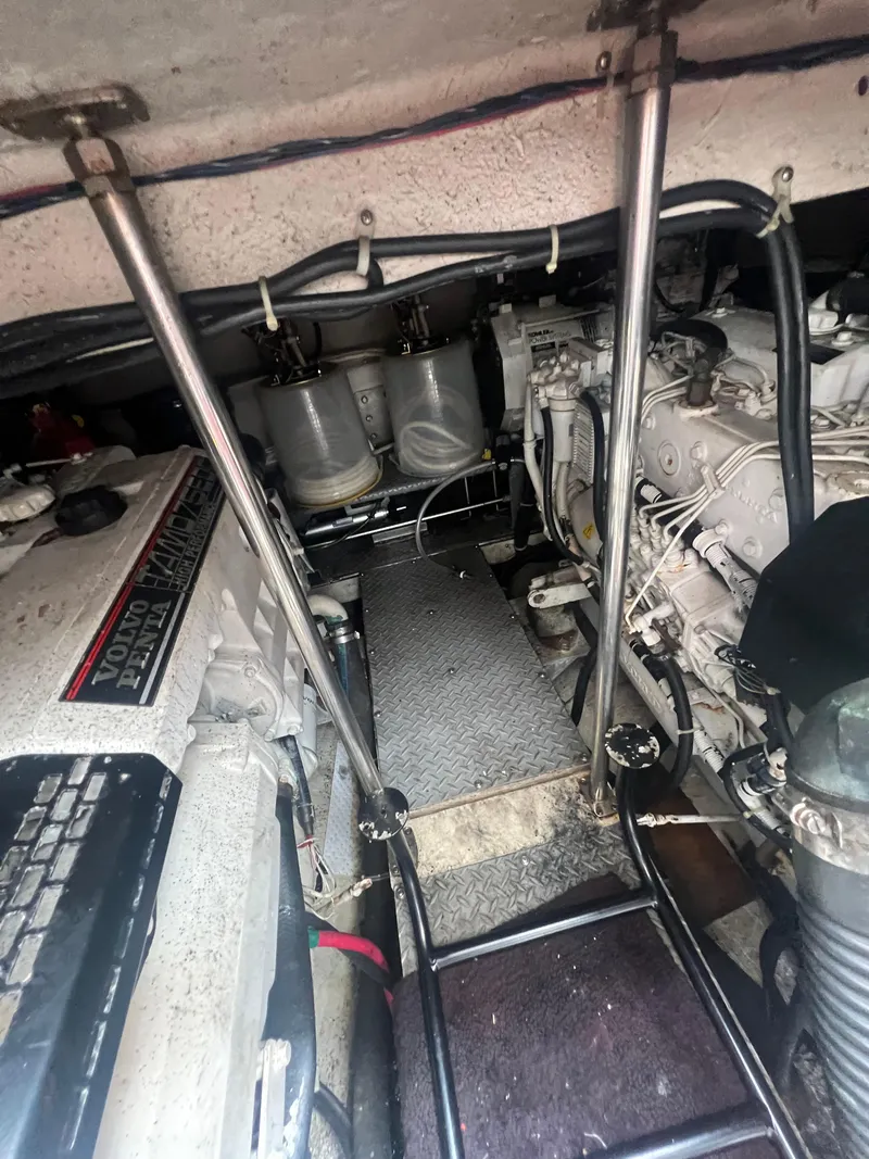 Slide: The Image of Engine compartment of a 2003 Regal Commodore 4260 boat, showcasing mechanical components. - 50