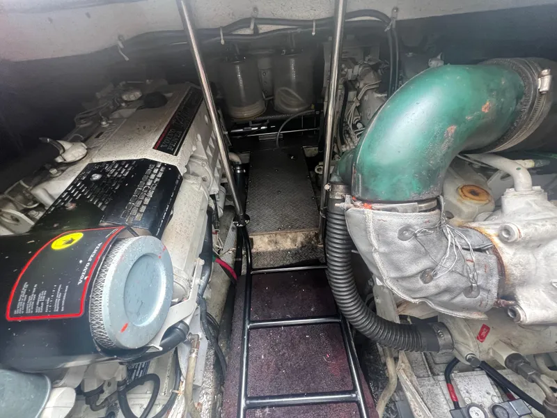 Slide: The Image of Engine compartment of a 2003 Regal Commodore 4260 boat, showcasing mechanical components. - 52