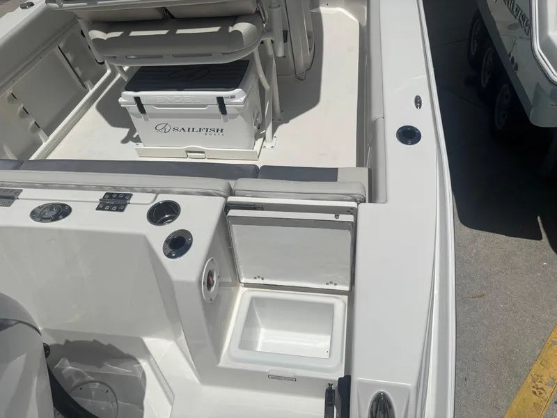 Slide: The Image of 2026 Sailfish 232 CC boat interior with seating and storage compartments. - 4
