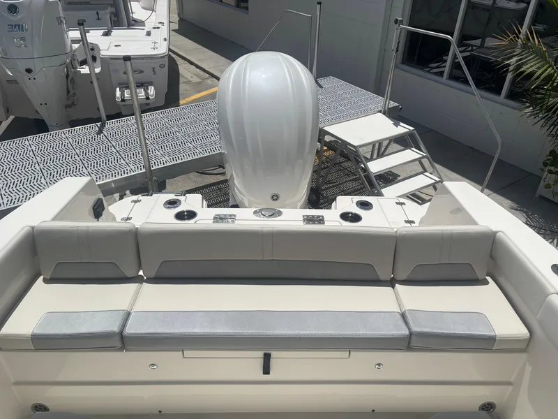 Slide: The Image of 2026 Sailfish 232 CC boat interior with cushioned seating and modern design. - 5