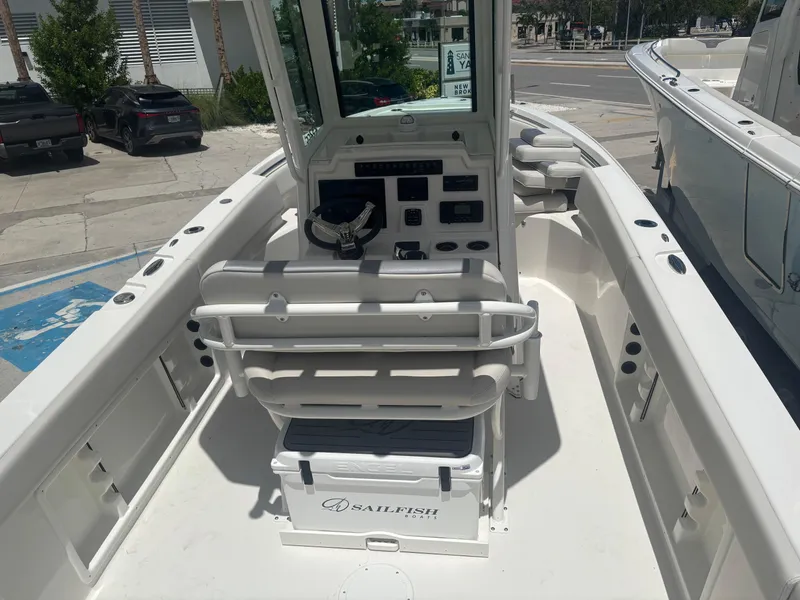 Slide: The Image of 2026 Sailfish 232 CC boat interior with helm, seating, and control panel. - 7