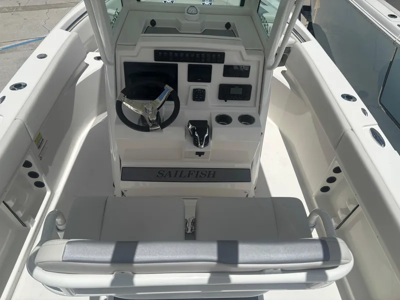 Slide: The Image of 2026 Sailfish 232 CC boat cockpit with steering wheel and control panel. - 9