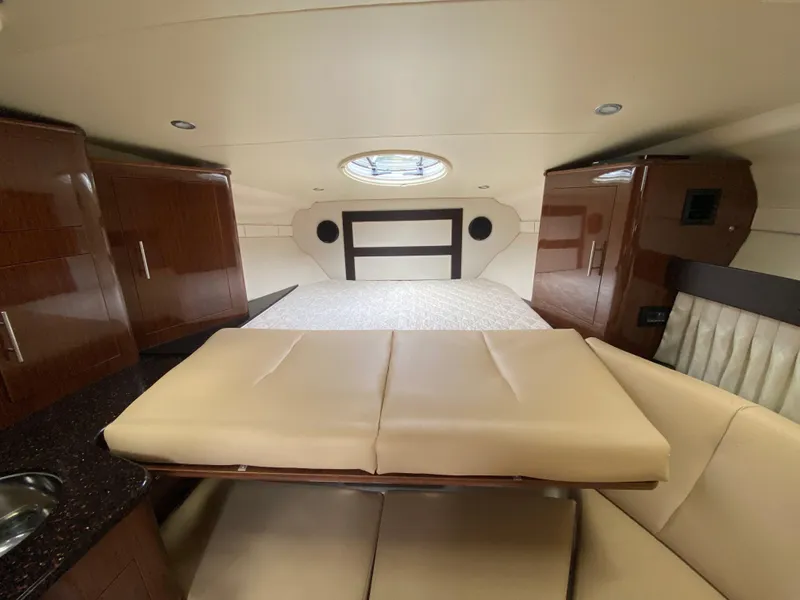 Slide: The Image of Interior of 2015 Regal 32 Express yacht with bed and seating area. - 26
