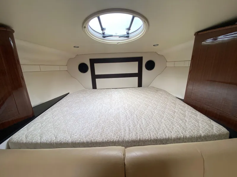 Slide: The Image of 2015 Regal 32 Express cabin interior with bed and skylight. - 27
