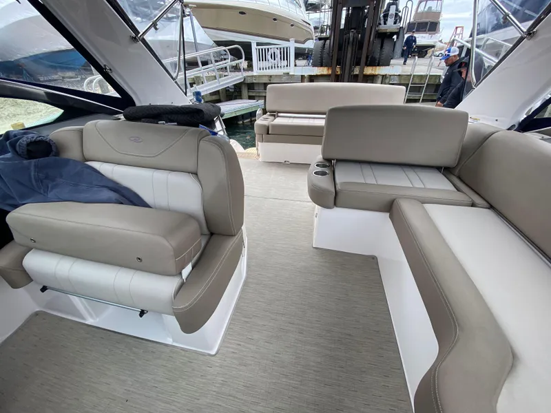 Slide: The Image of 2015 Regal 32 Express boat interior with beige seating and modern design. - 30