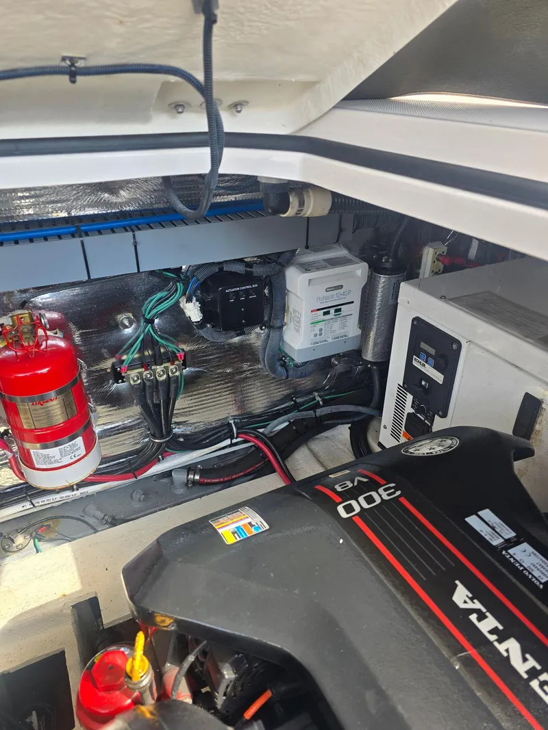 Slide: The Image of Engine compartment of a 2015 Regal 32 Express boat with Volvo Penta components. - 32