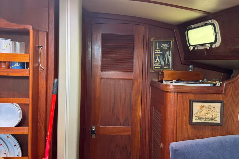 Slide: The Image of Interior of a 1984 Endeavour 33 yacht with wooden furnishings. - 10