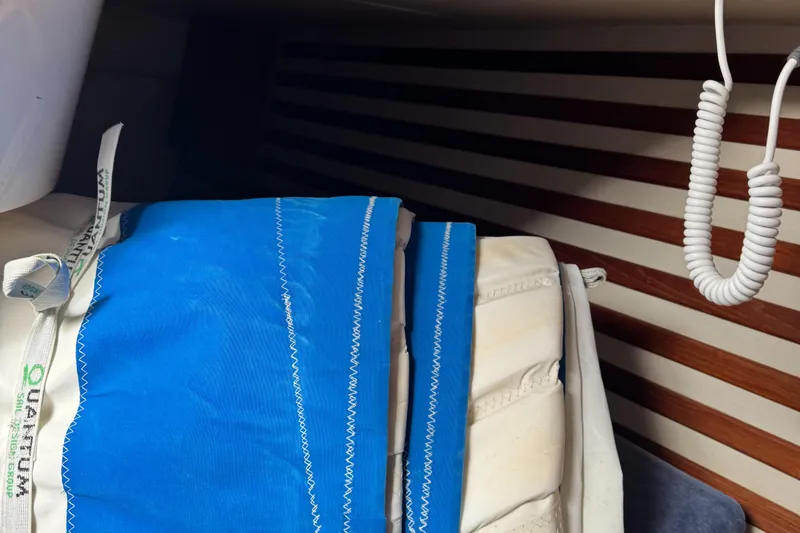 Slide: The Image of Interior of a 1984 Endeavour 33 yacht with blue sails. - 15