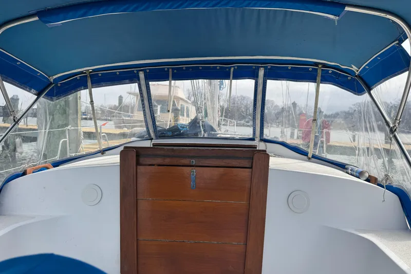 Slide: The Image of Interior view of a 1984 Endeavour 33 yacht with blue canopy. - 4