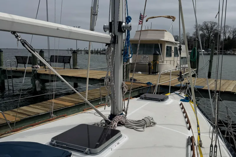 Slide: The Image of 1984 Endeavour 33 sailboat docked with calm waters. - 6