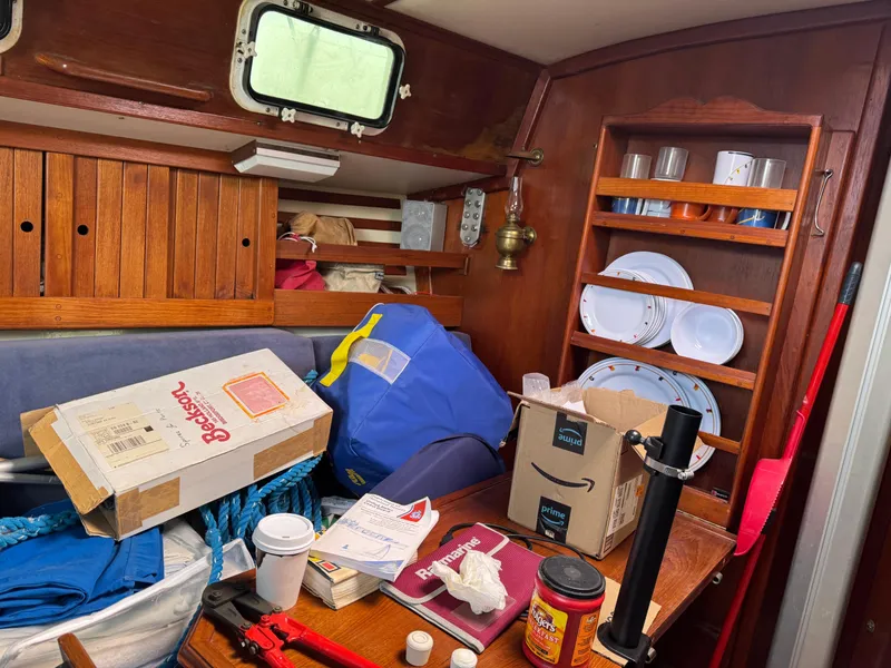 Slide: The Image of Interior of a cluttered 1984 Endeavour 33 sailboat cabin. - 9