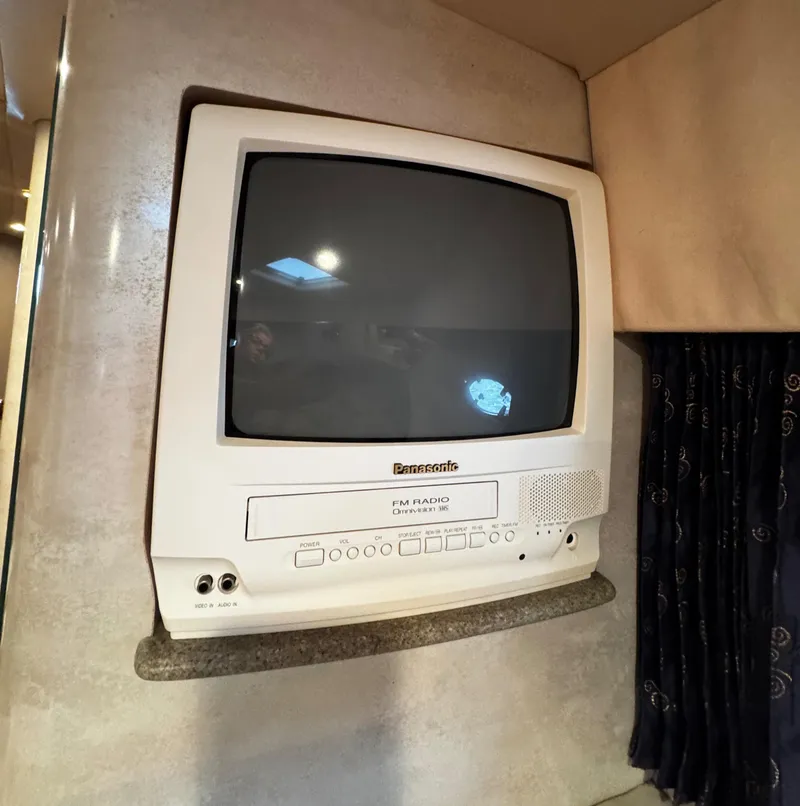 Slide: The Image of Built-in Panasonic TV and radio unit in a 2001 Formula 40 PC boat interior. - 45