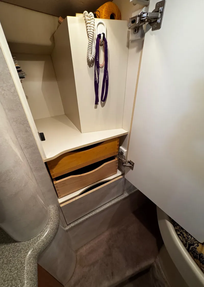 Slide: The Image of 2001 Formula 40 PC interior cabinet with open door and organized storage. - 46