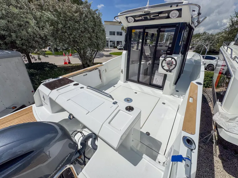 Slide: The Image of 2022 Jeanneau NC795 Sport boat with sleek design and modern cockpit. - 4